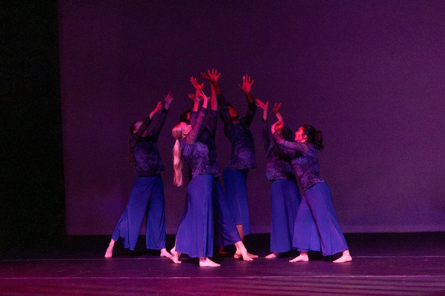 Dancers reaching up